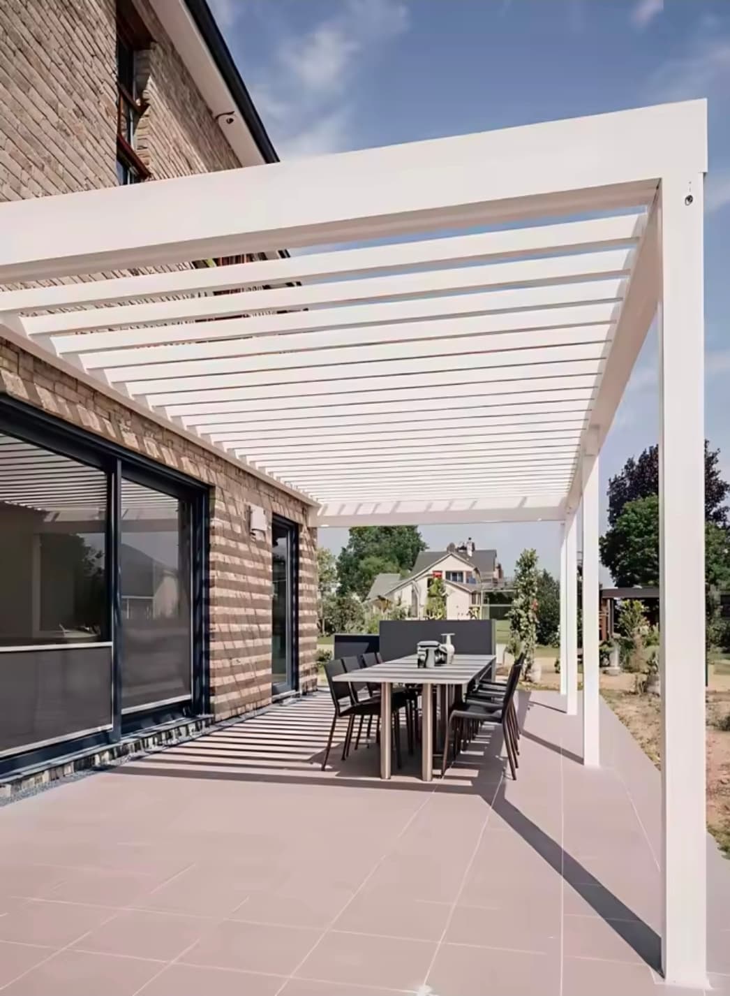 White aluminium pergola with outdoor dining set