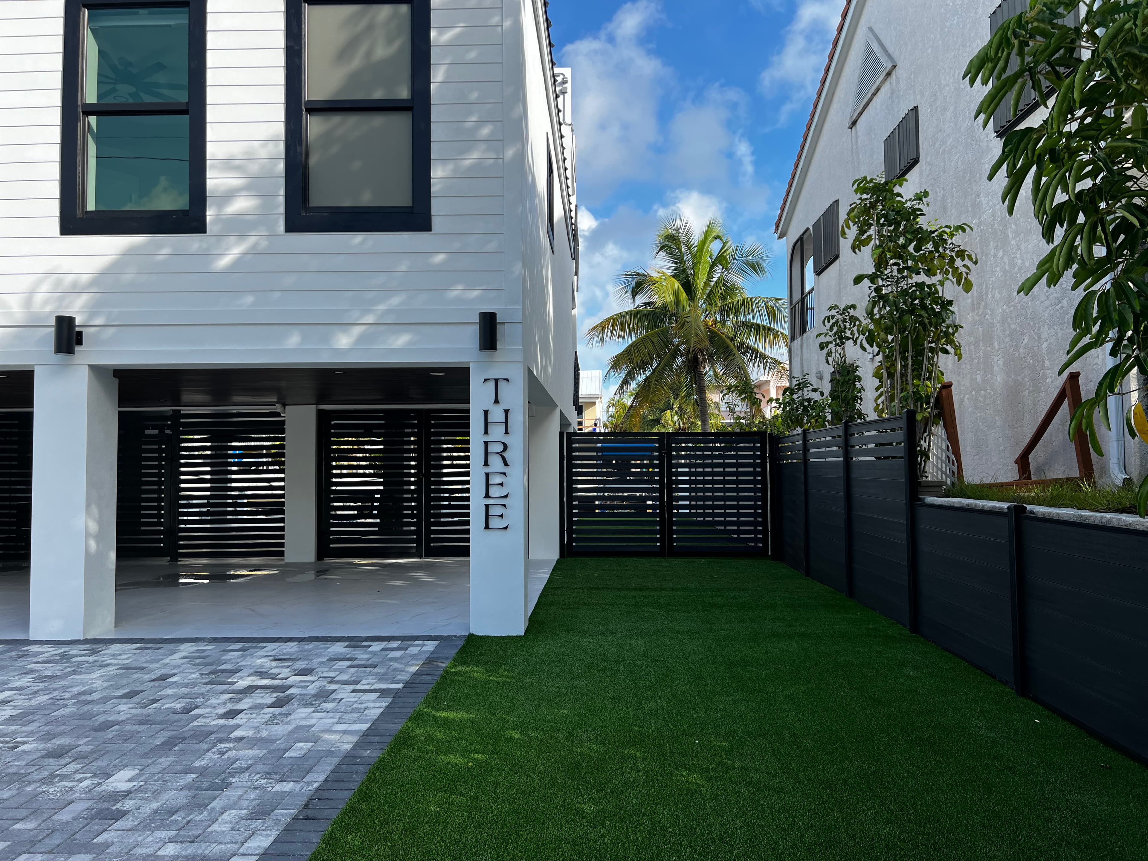 Black WPC horizontal fence modern home Miami